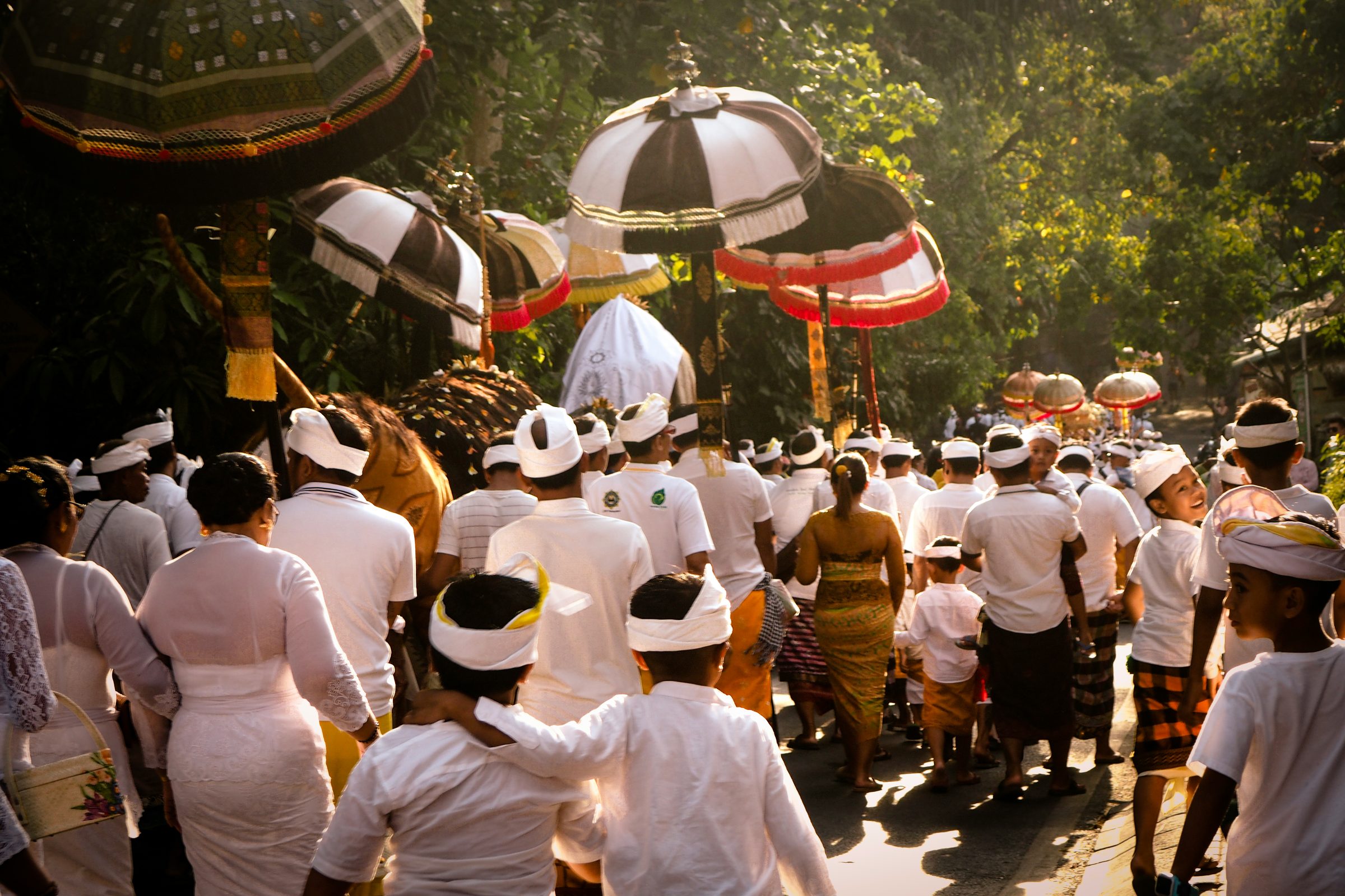 People participating in a Balinese religious procession